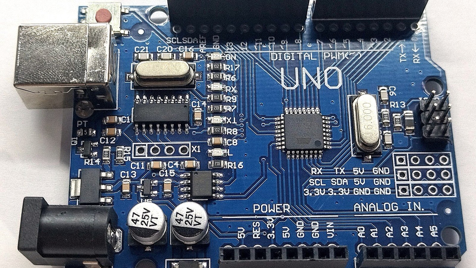 Arduino Uno development board; illustrative photo, not the Arduino UNO Q.