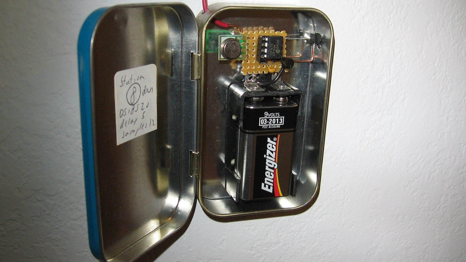 Open wireless temperature sensor prototype with a small development board and breadboard.