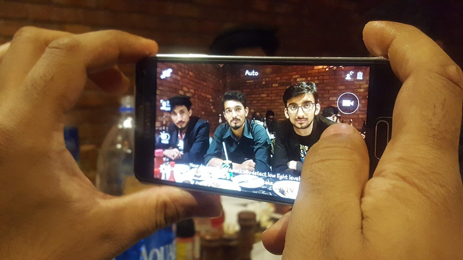 A smartphone being used to take a photo, representing a phone prepared for travel.